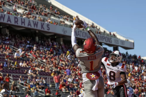 ULM tight end, Julian Nixon, catching a pass against Arkansas State in the Rice Bowl Rivalry.