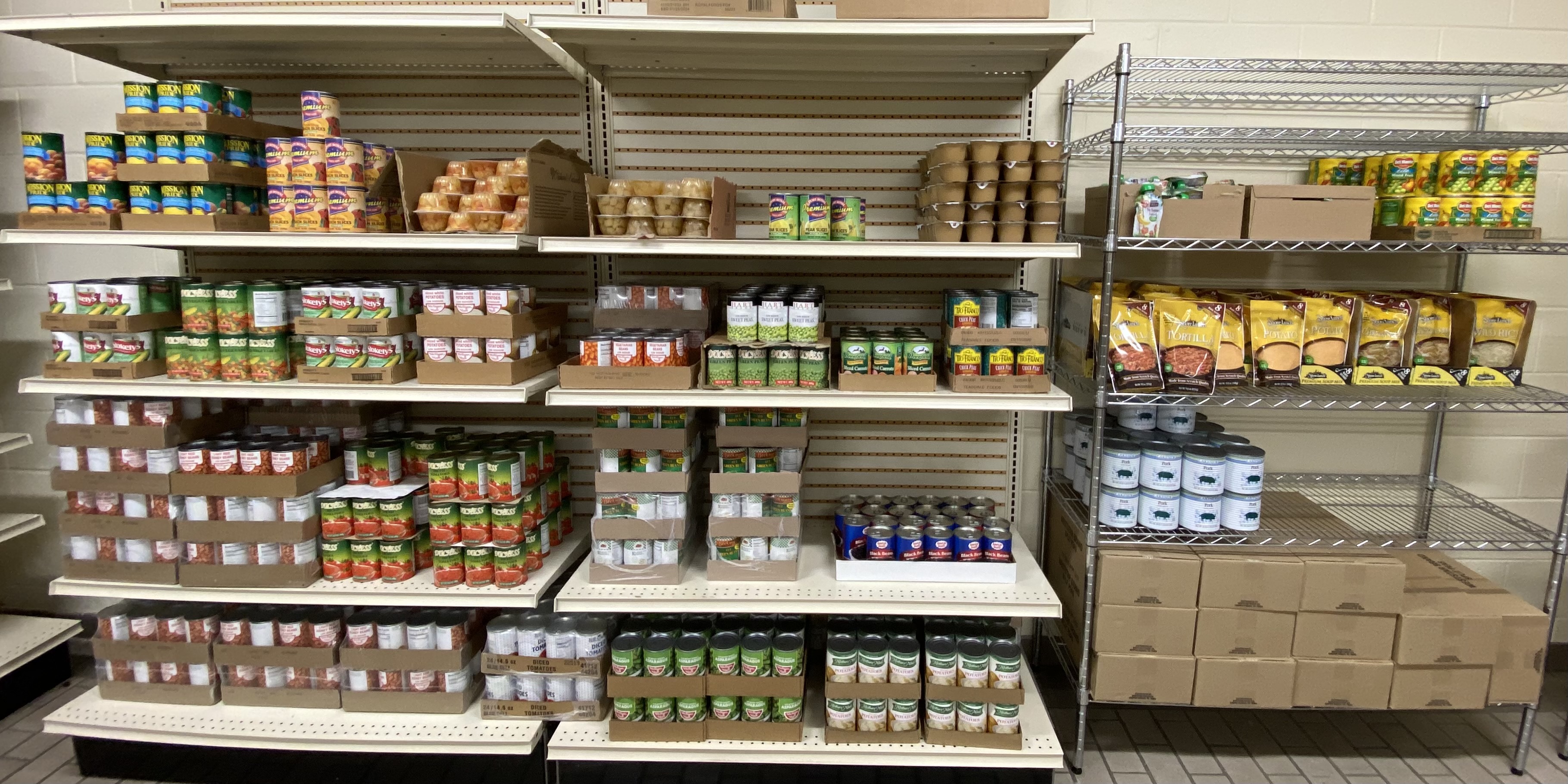 Local food pantry shelves stocked and ready for distribution to families in need.